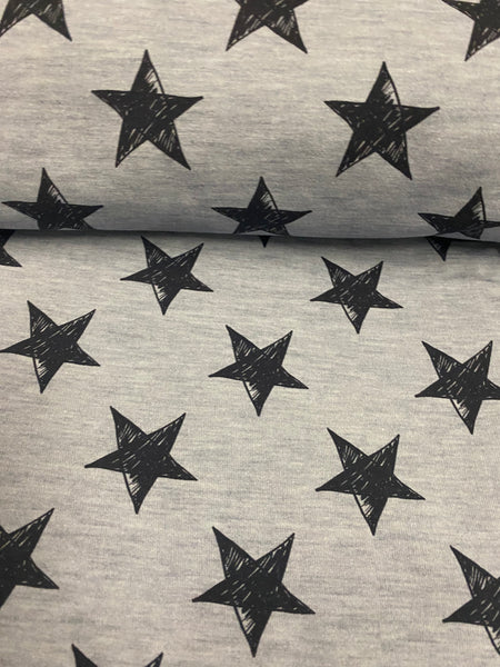 Fabric Black Grunge Stars on Light Blue Knit